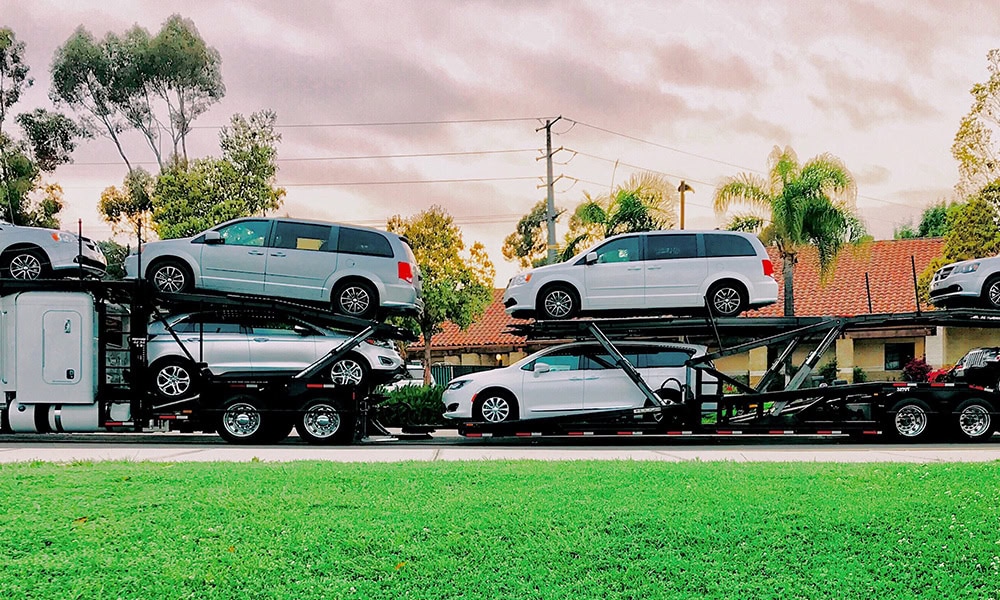 A car carrier with cars stacked on top